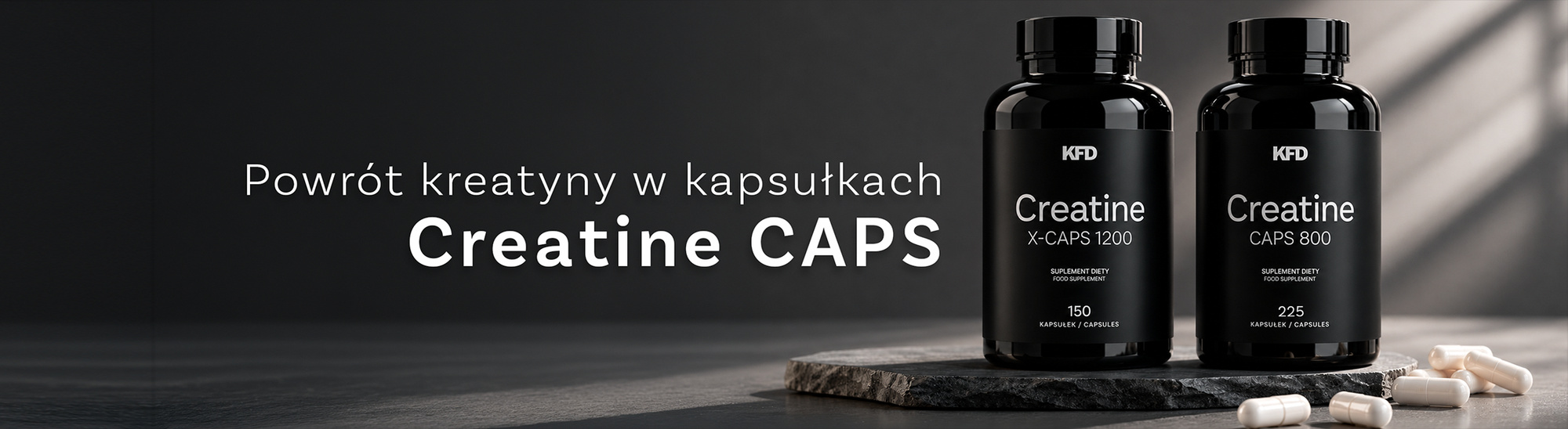 Butelki KFD Creatine X-CAPS 1200 i Creatine CAPS 800 na kamiennej podstawce, obok kapsułki